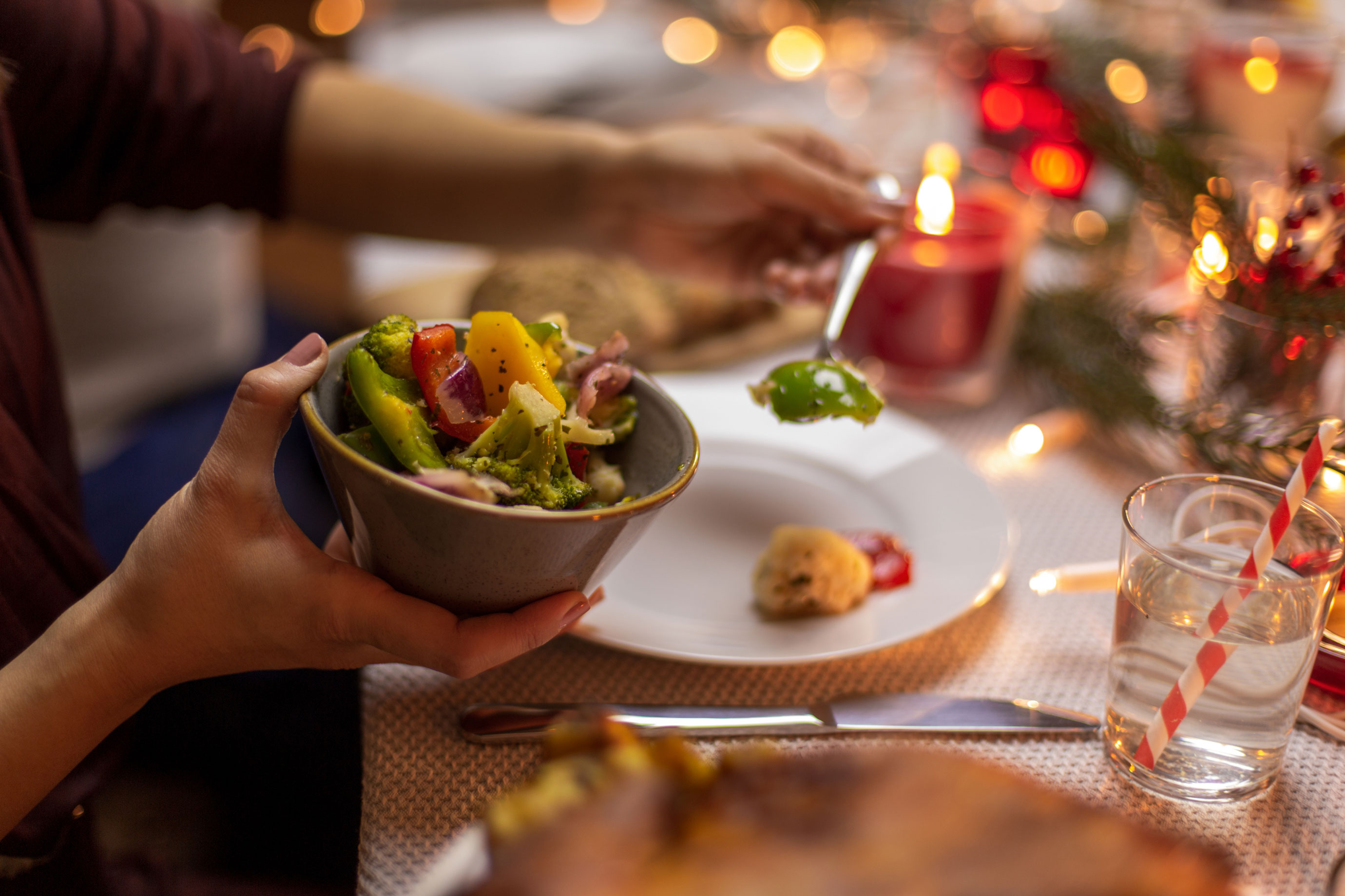 Person putting festive food on their plate